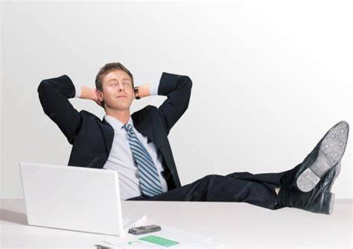 Businessman day dreaming on a wheelchair Stock Photo Alamy