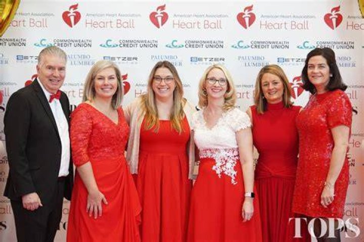 Heart Ball honoree Amy Tarkanian holding a Michael E Minden custommade
