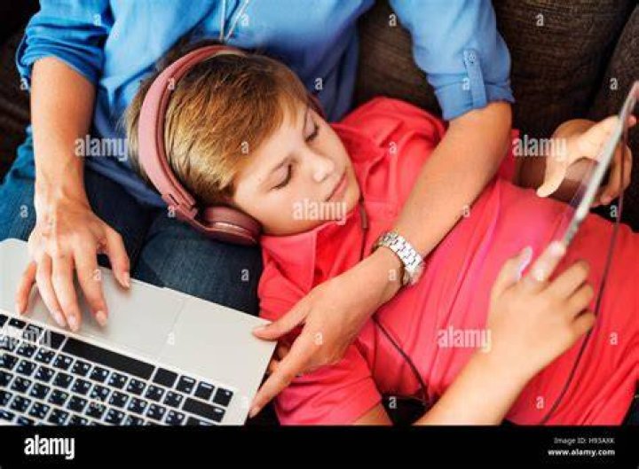 Mom Son Holidays Using Electronics Multimedia Concept Stock Photo